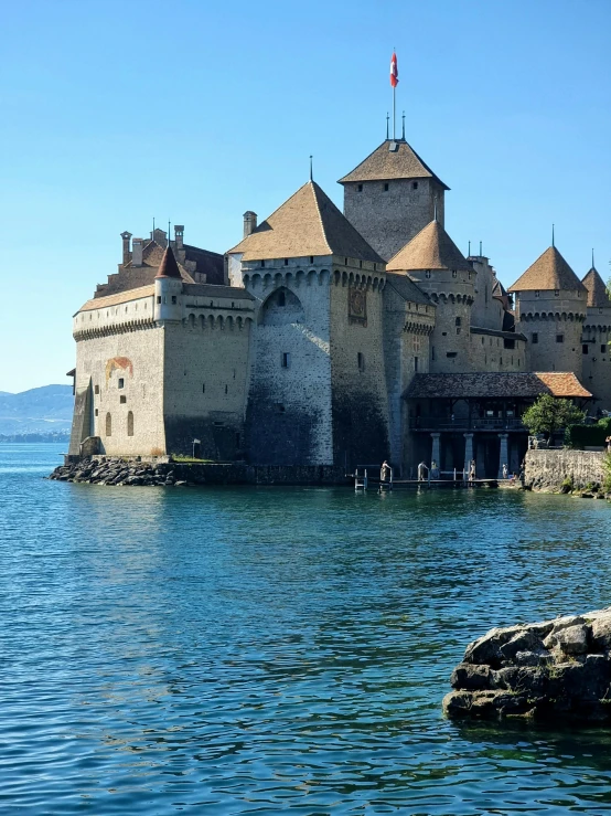 an old building that is sitting in the water