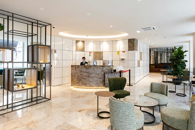 this is an office lobby with chairs and lights