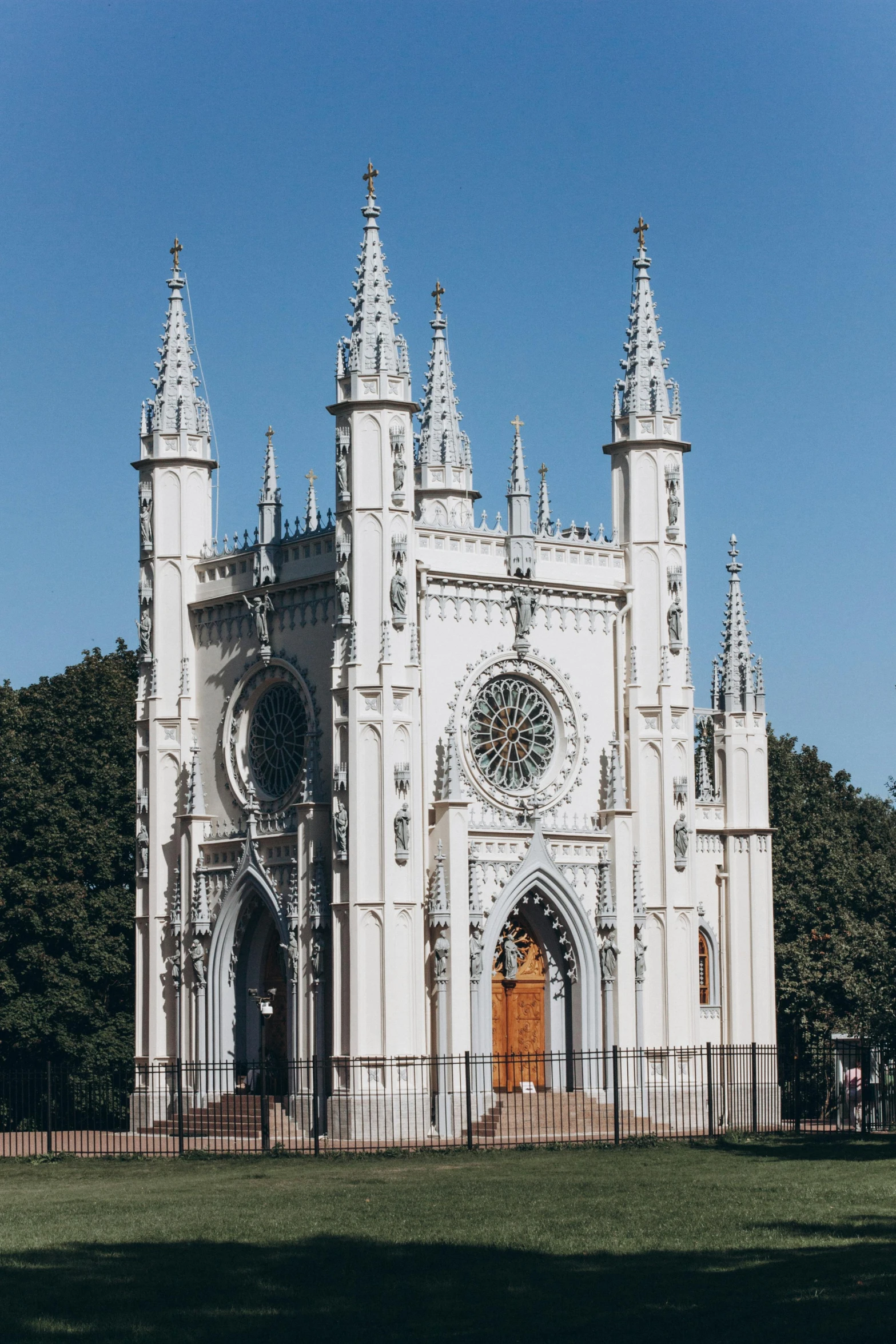 a church with an ornate design and steeple design