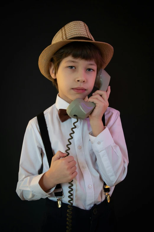 a  holding a telephone to his ear