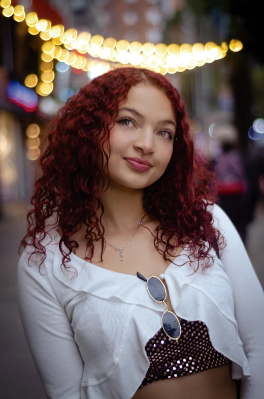 a young lady is posing for a po in the dark