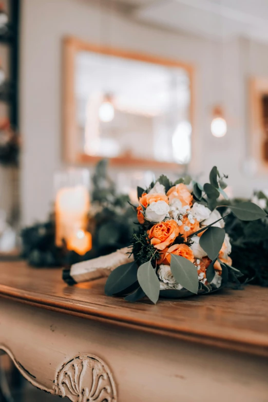 the bouquet on the table is laying on the surface