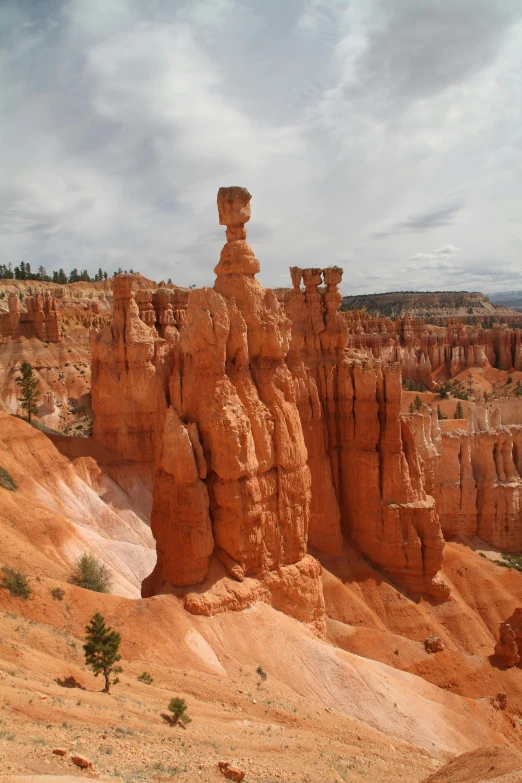 a group of large rocks with formation formations behind them