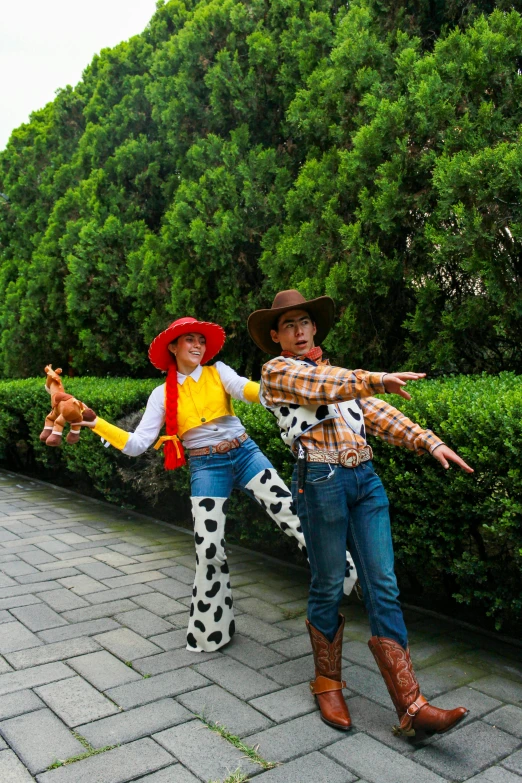 there are two men dressed in costumes and western gear