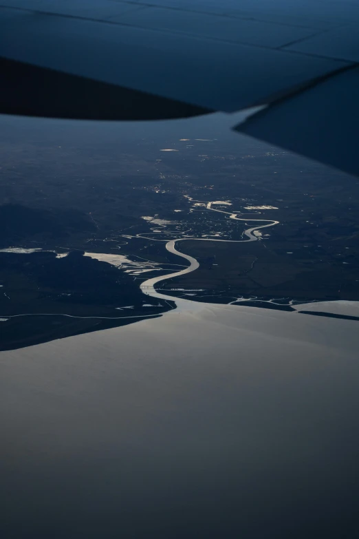 a view from the airplane window of a river