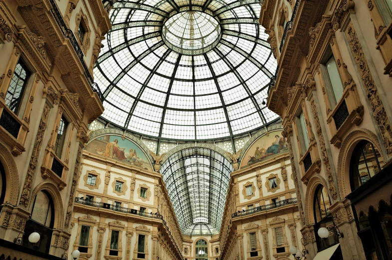 an interior view of a mall with lots of windows