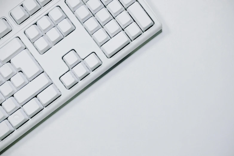 a keyboard is laying on its side near some keys