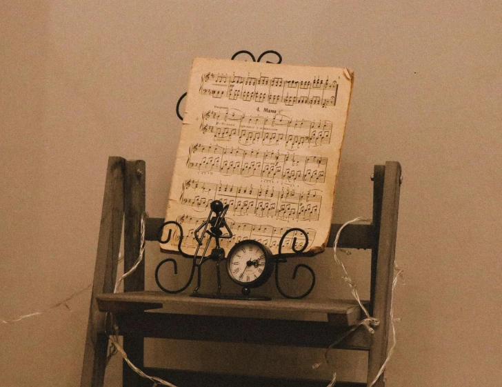 a small chair with some music written on it