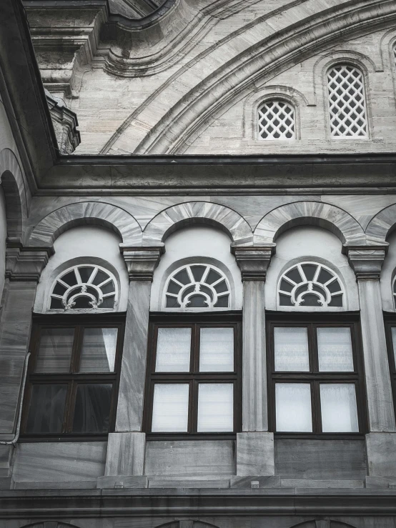 three windows that are in a building