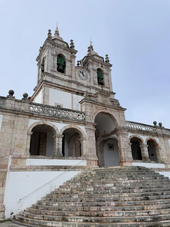 stairs lead up to the tower and windows on an ancient building