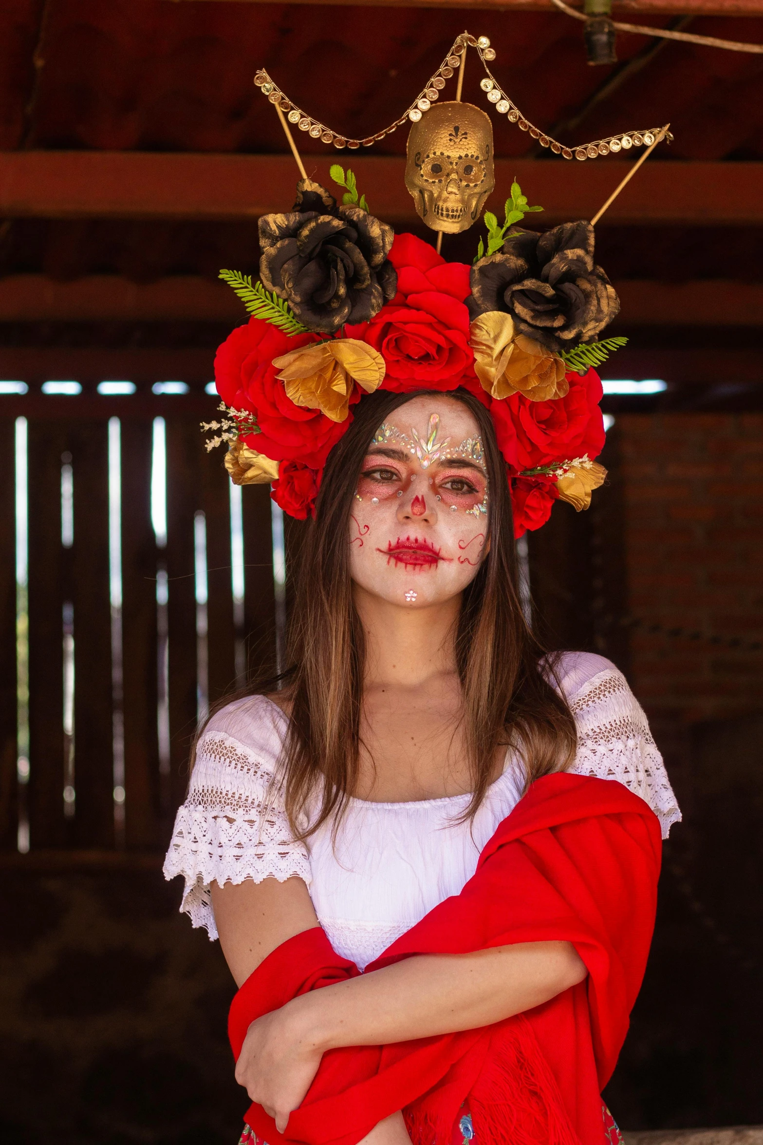 the girl wearing makeup has flowers on her head