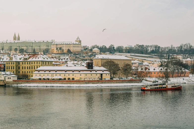 some buildings with a boat in the water