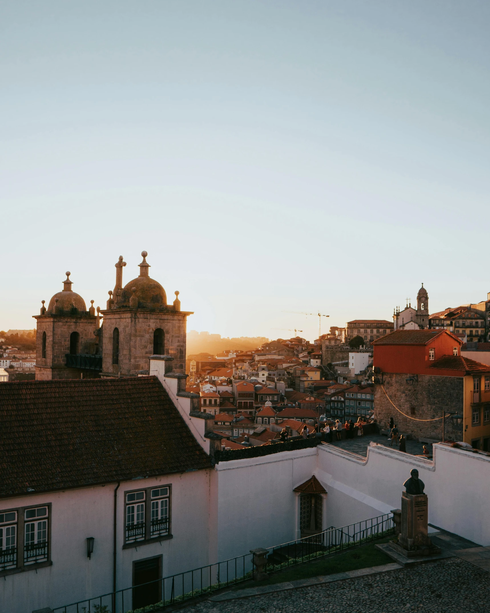 a group of buildings on the top of a hill