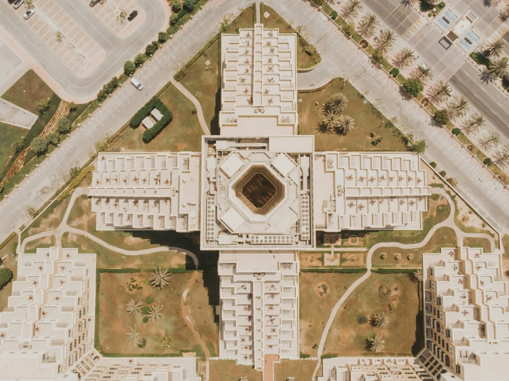 a very large building that is surrounded by grass