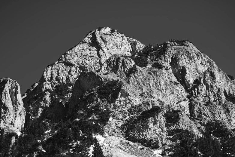 black and white pograph of mountain tops taken in the wild