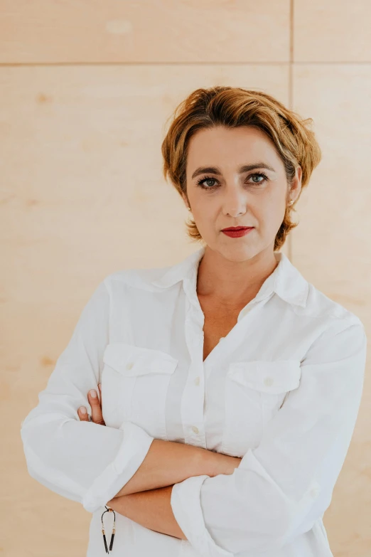 a woman poses for a po while wearing white