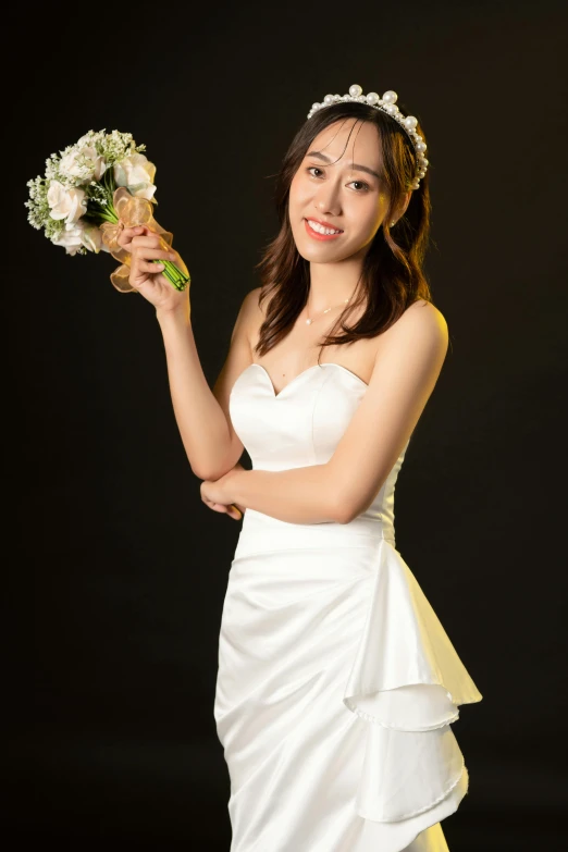 a woman is posing with her bouquet