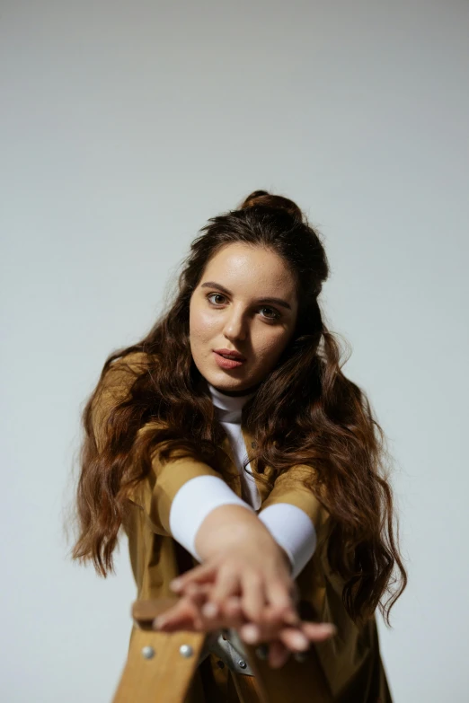 a woman posing in the middle of a hand to show the time