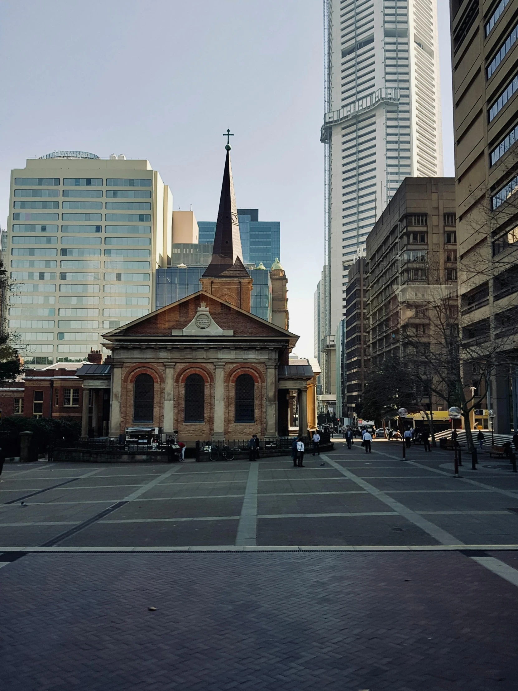 a city street with buildings in the background