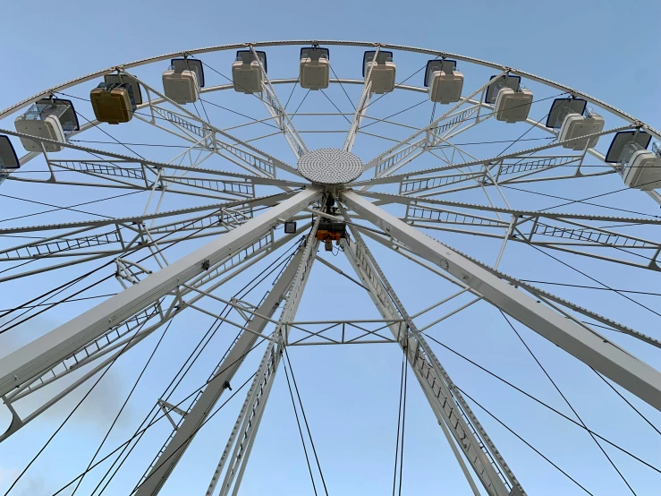 the ferris wheel is looking very big with no people around it