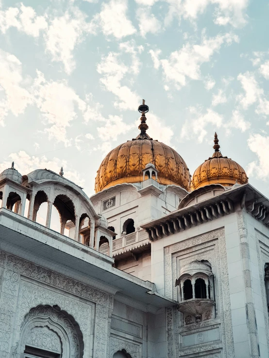 a close up s of an ornate building with gold domes