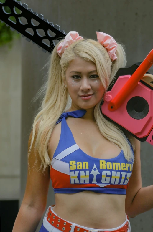 a woman dressed in cheerleader gear with some equipment