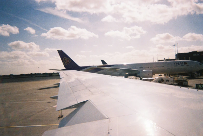 a view from the plane's wings, of another plane