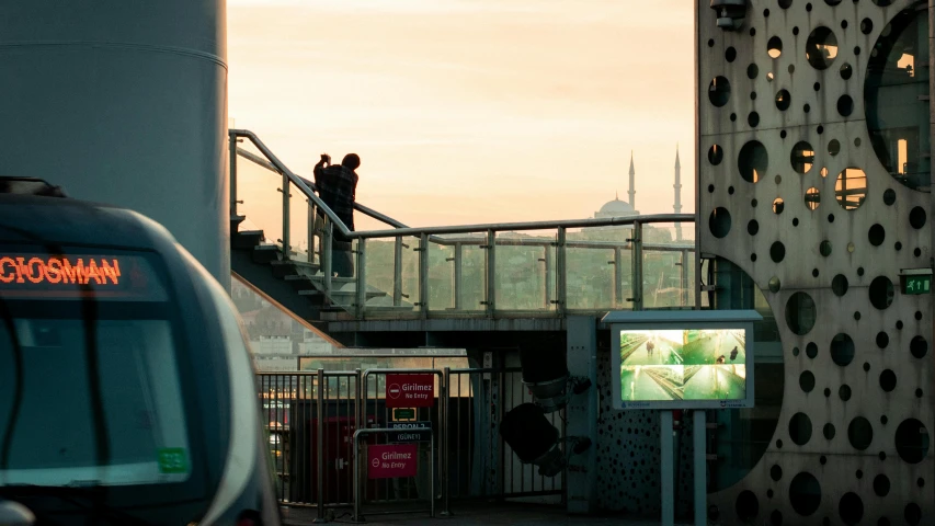 a person is walking up steps next to a city