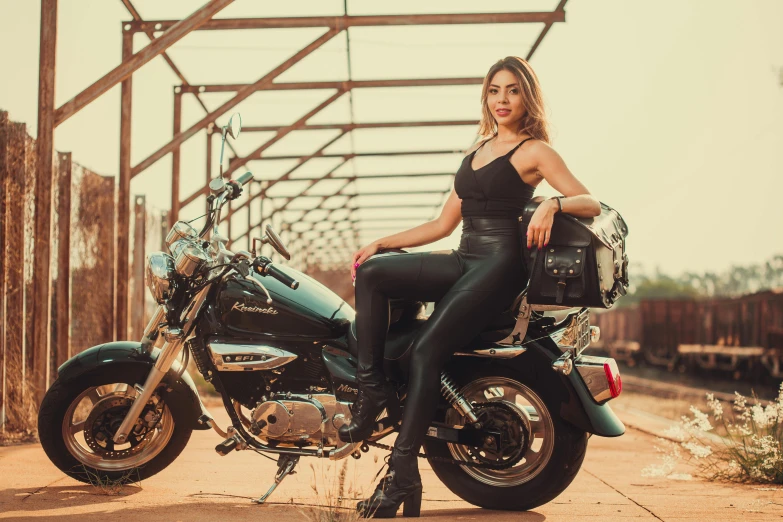 there is a woman that is sitting on a motorcycle