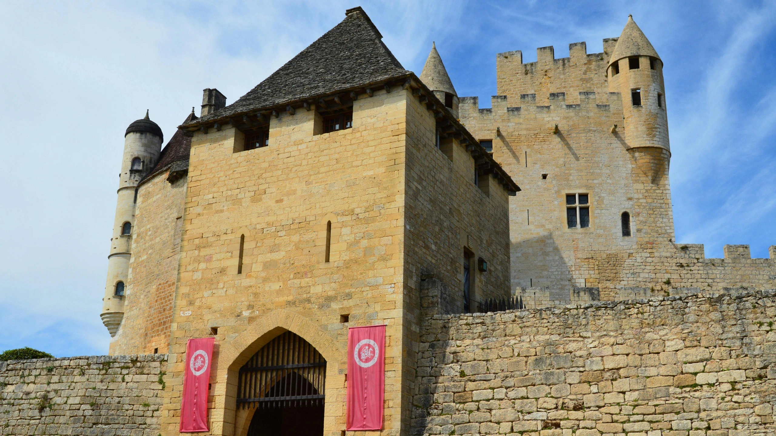 an old castle with the flag of morocco behind