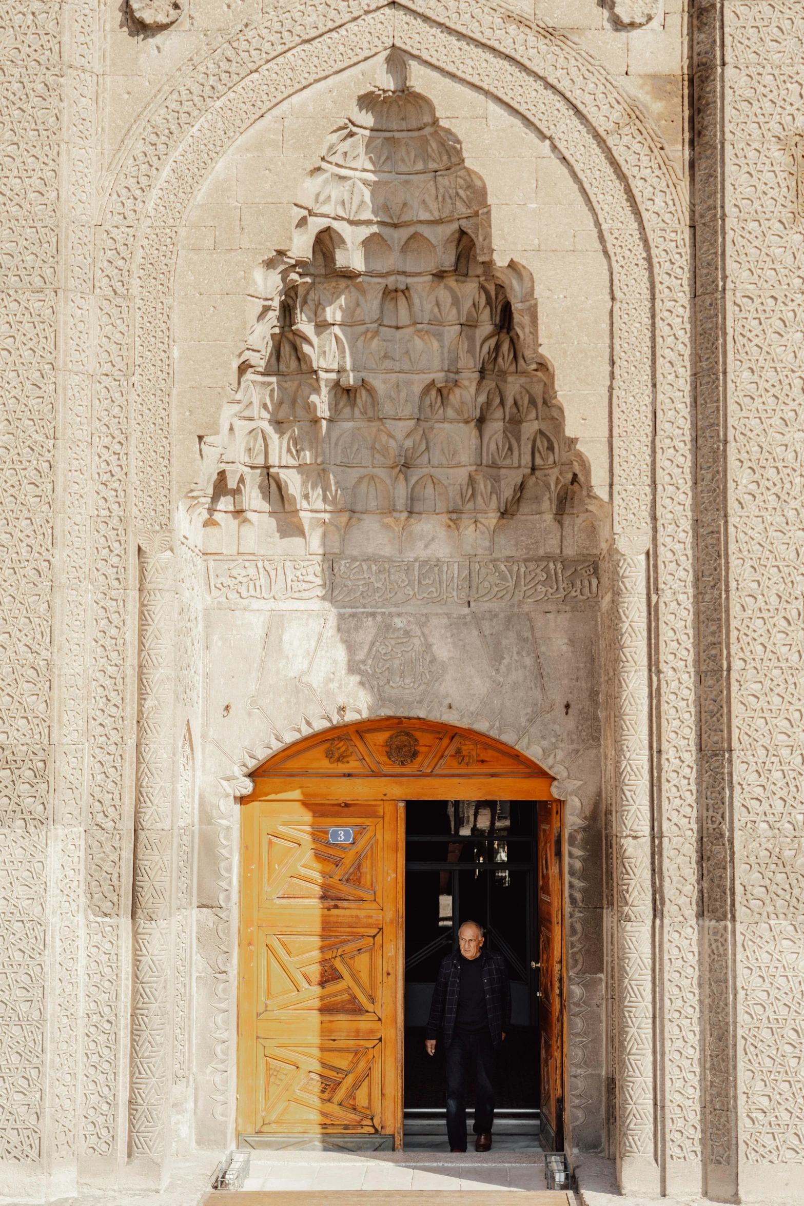 an archway is seen with a door opening