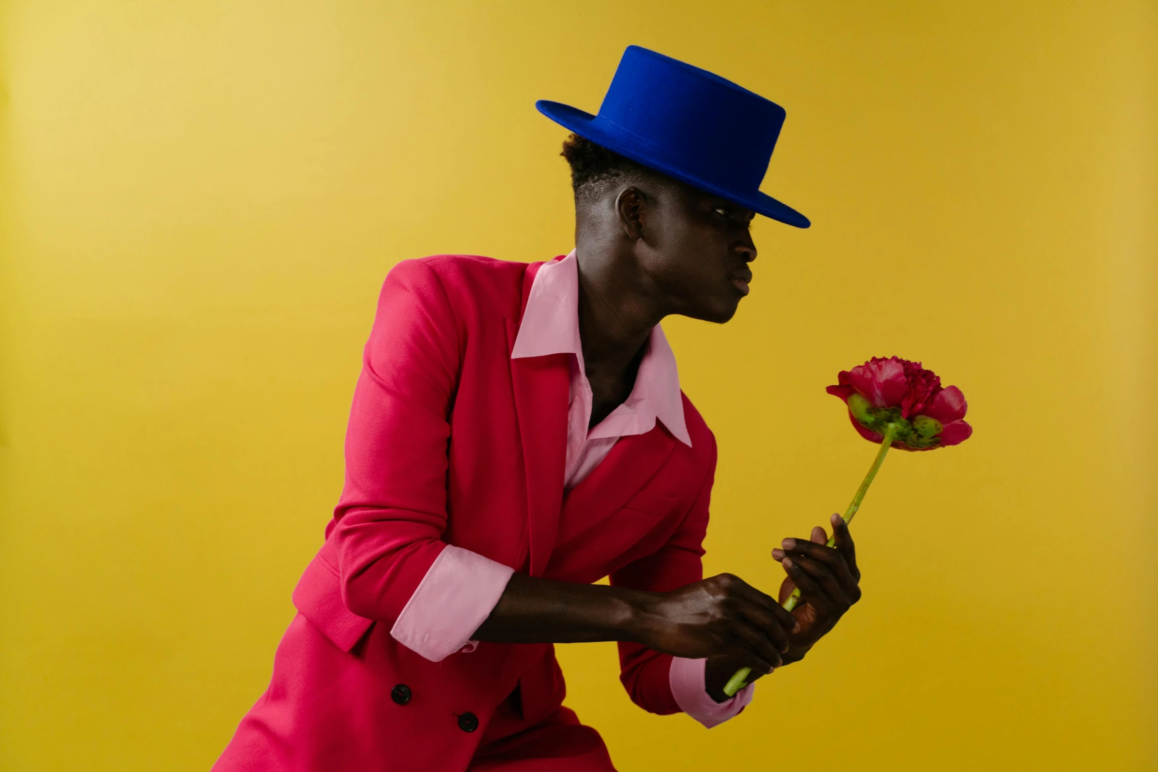 an image of a woman wearing red with a blue hat