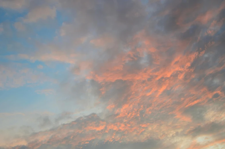 a colorful sky has some very pretty clouds