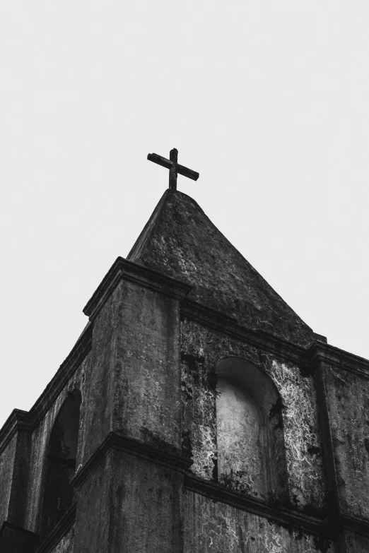 the cross on top of an old building