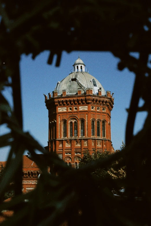 this old building has an interesting tower and a roof