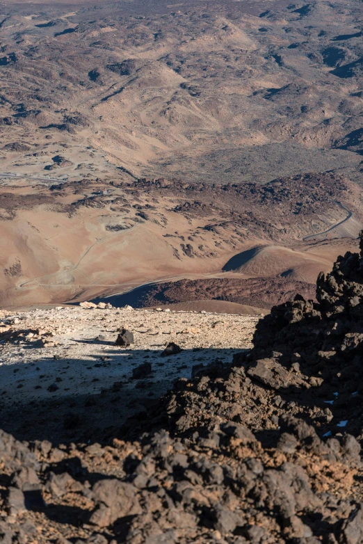 a very view down at some rocks and mountains