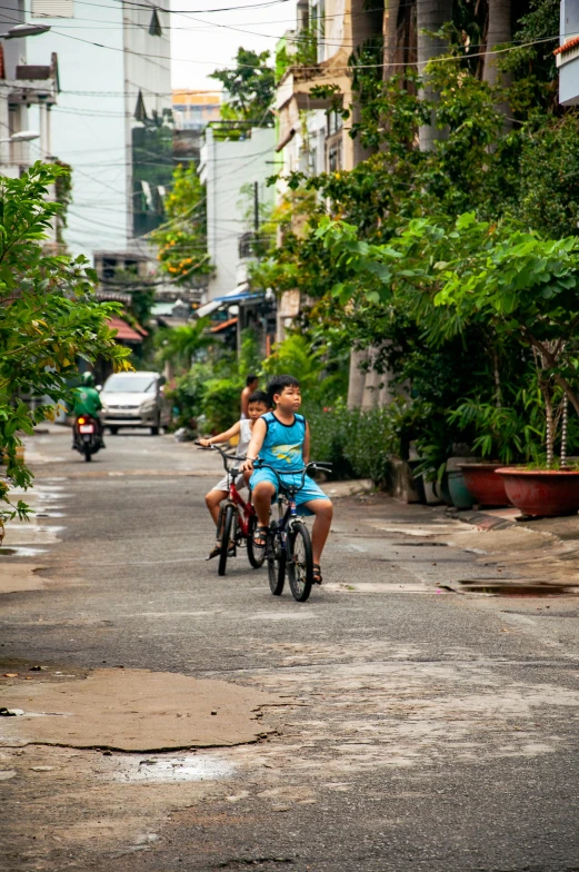 a man and woman are riding on a bike