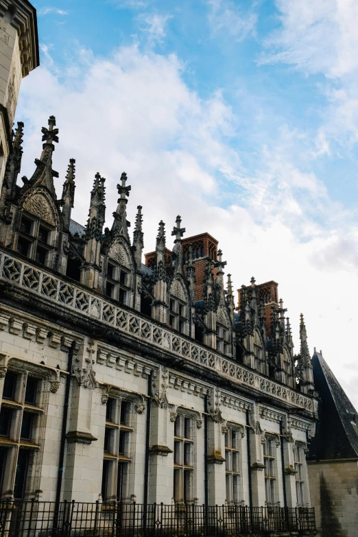 a view of many architecturally ornate building with a clock on it