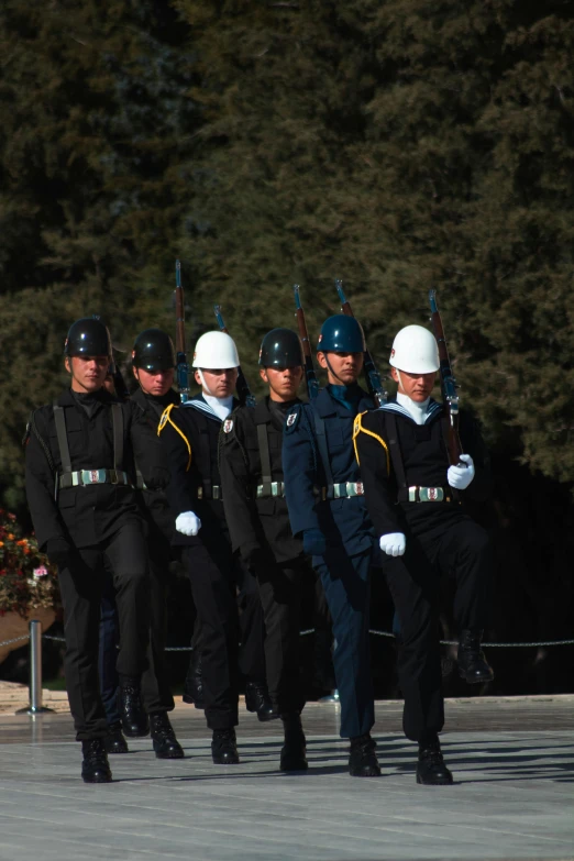 men in police uniforms are lined up together