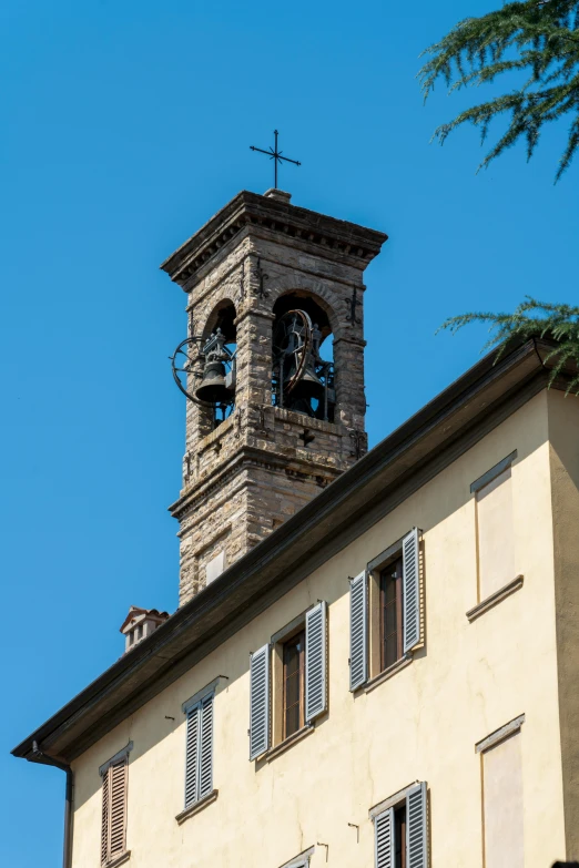 a bell tower that is on the side of a building