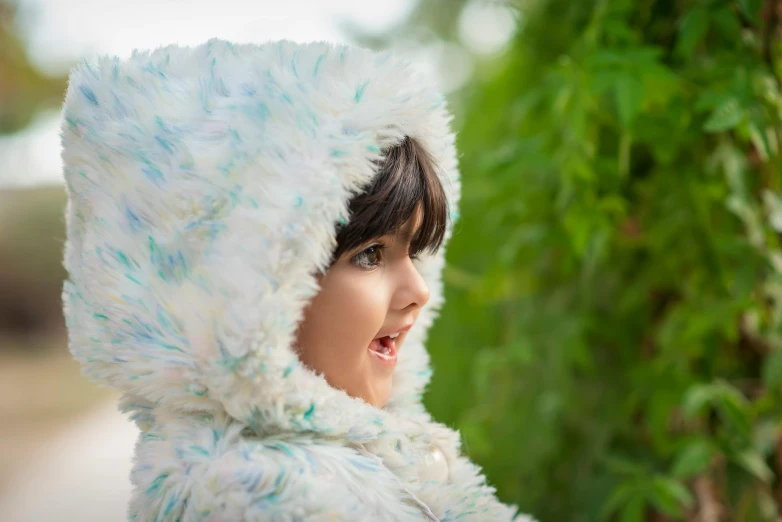 a  wearing a fur coat in the outdoors