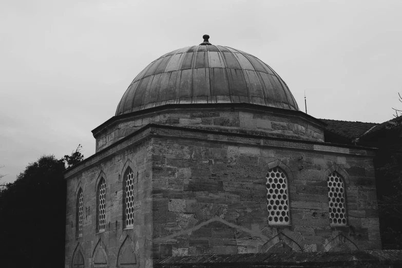 a black and white po of a domed structure with windows