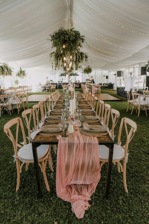 a group of chairs are set with a table