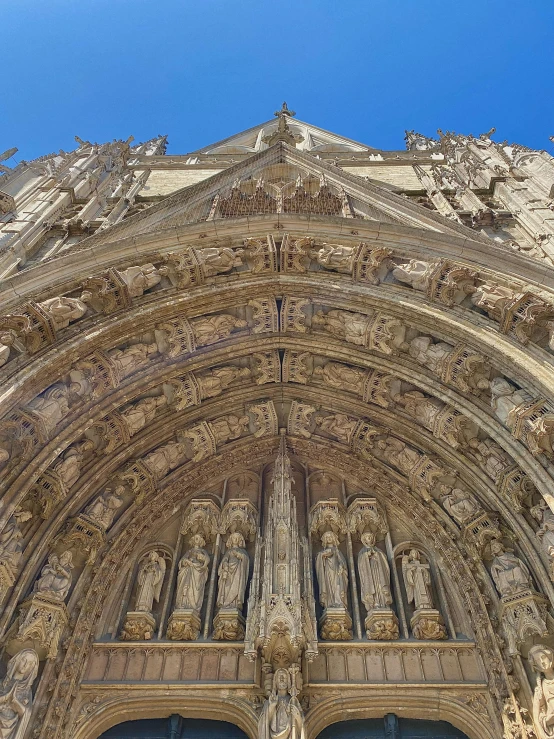 the tall cathedral is decorated in wood carvings