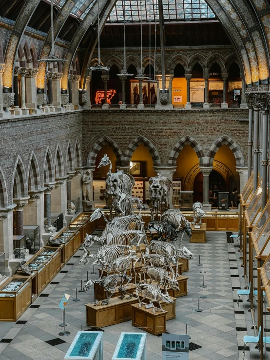 this large lobby has sculptures on either side of the atrium