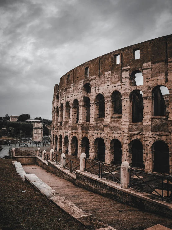 an ancient building that is part of a large arena