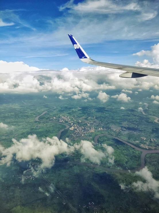 an aerial s of some clouds above a city