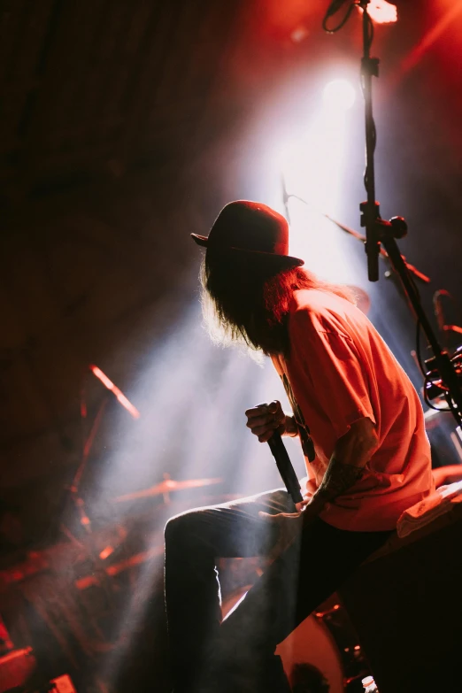 a man with his hands on the drums playing music