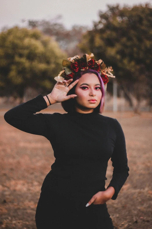 a beautiful young woman wearing a crown of flowers in her hair