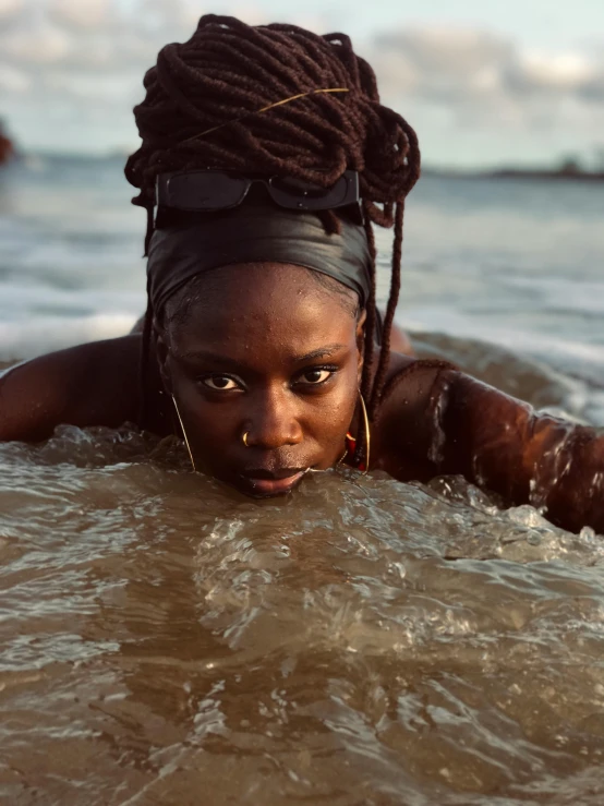 a beautiful black girl swimming in the ocean